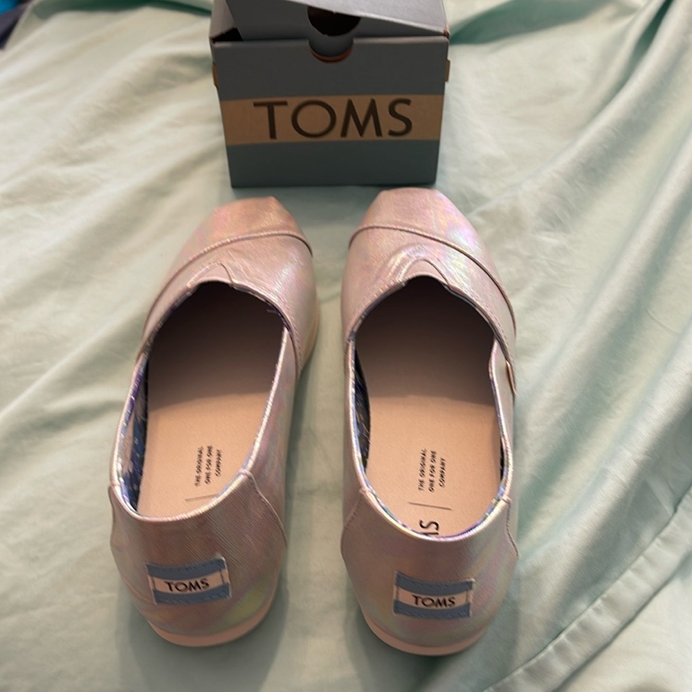 Brand new, never worn.  Still in box.  Silver metallic gray canvas.  Iridescent.